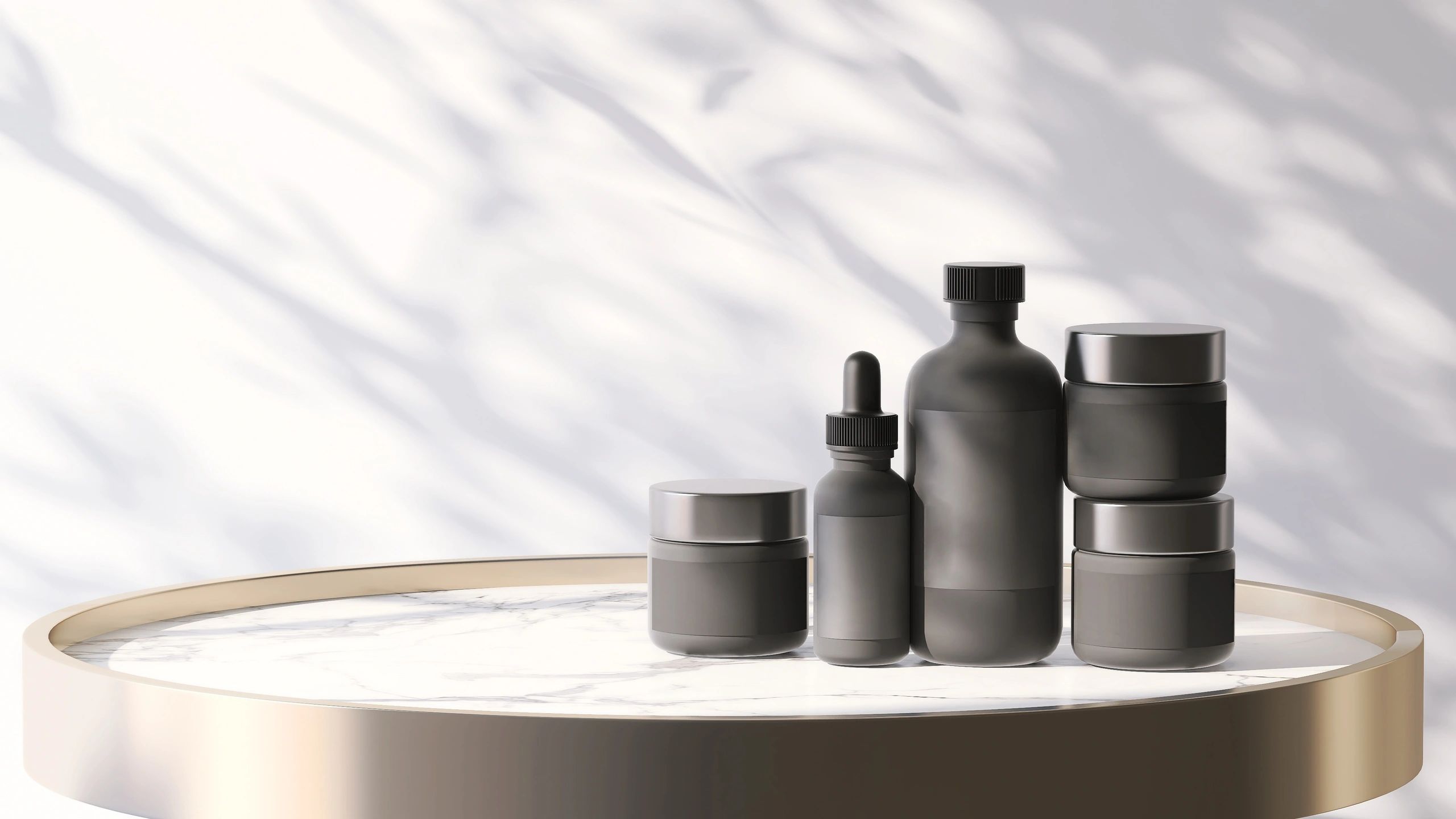 Luxury cosmetic bottles and jars arranged for beauty branding