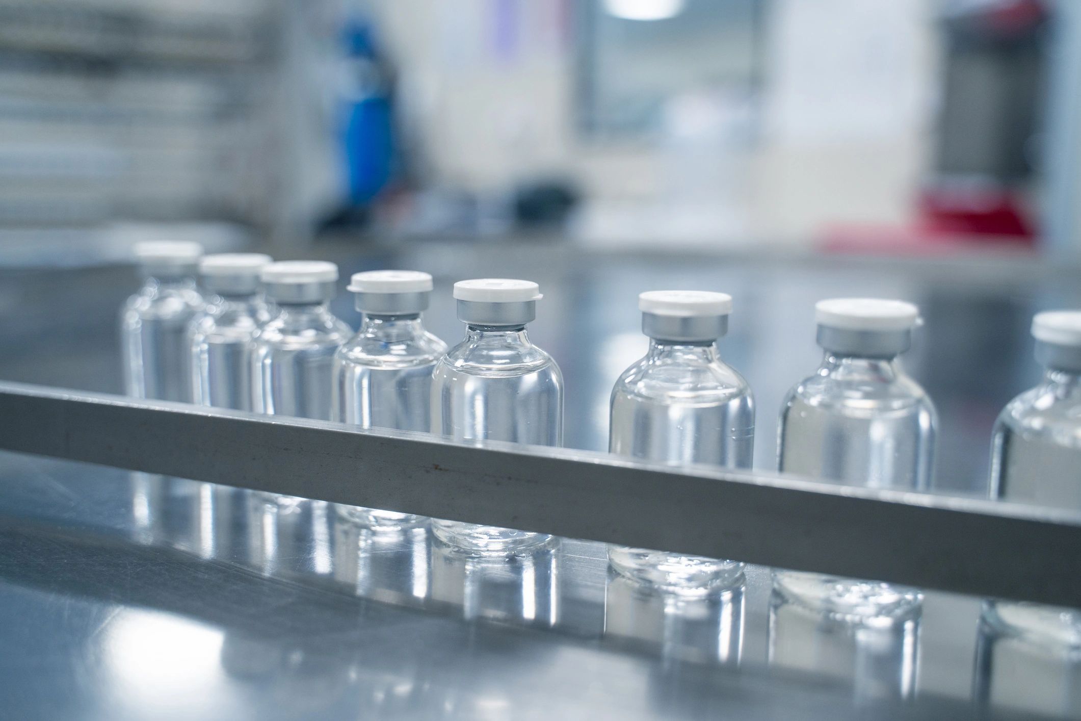 Manufacturing bottles moving on a production conveyor line
