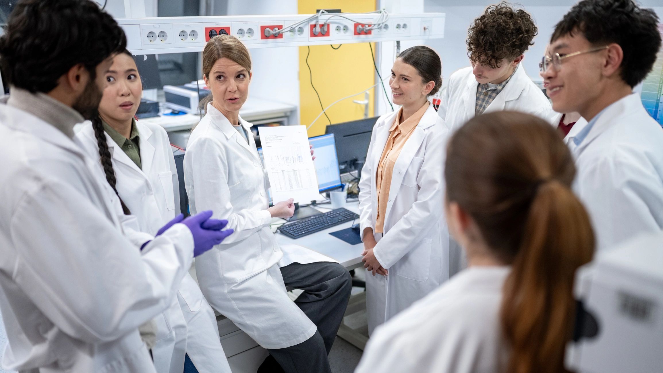 Laboratory team collaborating on formulation development