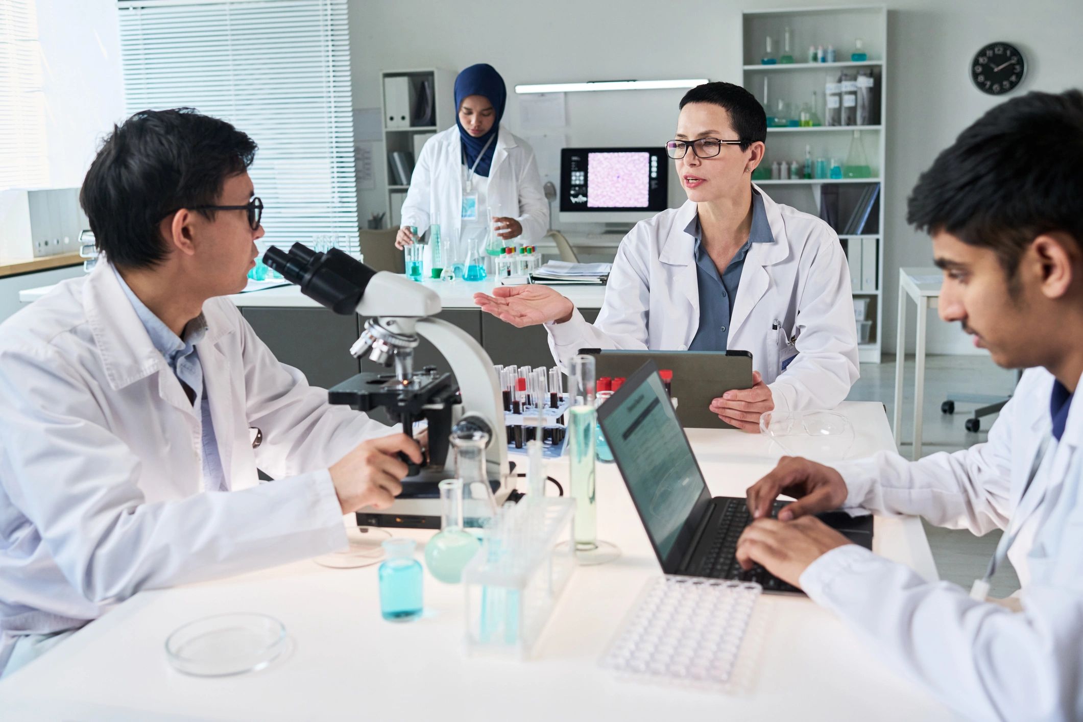 Scientists collaborating in a laboratory meeting